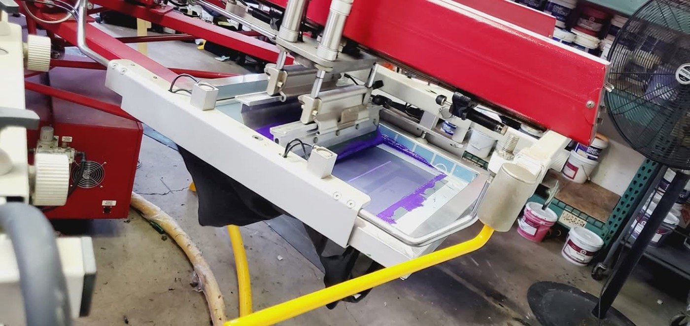 Ink being pulled through a screen on a local press in Addison, IL